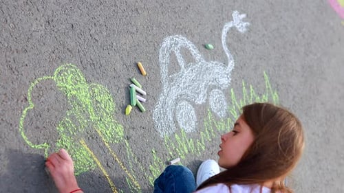 Little Girl with Creative Craft Hobby Drawing Electro on the Asphalt with Chalk Car Environment Eco