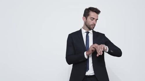 Confident Man in Suit Checking His Watch