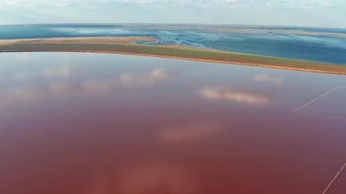 Beautiful top view of the salty, pink lake. Beautiful pink sunset.