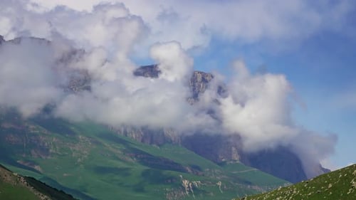 Scenic Mountains with Green Valleys and Clouds