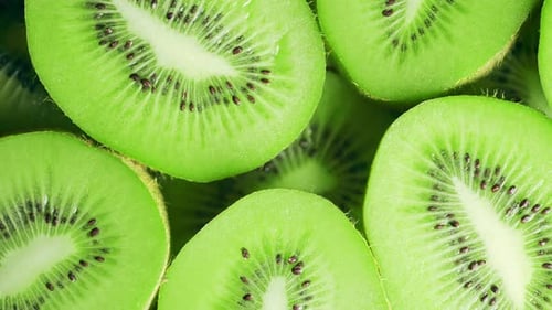 Slow Motion of Rotation Ripe Green Sliced Kiwi