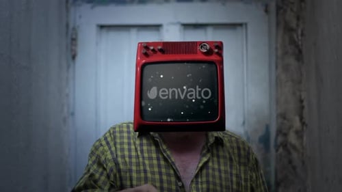 Man with TV Head Stands Indoors