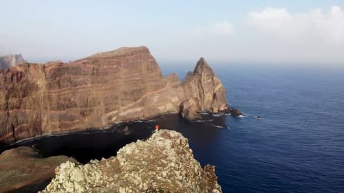 Man Standing on Mountain Top at Ponta de Sao Lourenco, Madeira Island, Portugal