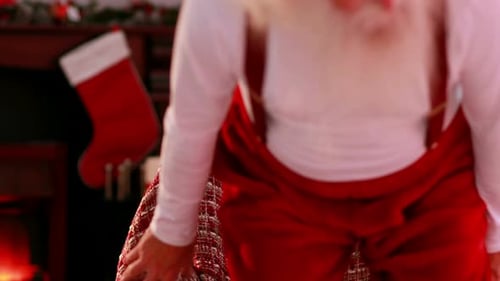 Santa Claus Napping by the Fireplace on Christmas