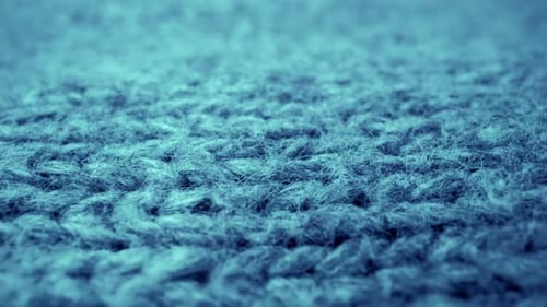 Extreme Detail View of Sheep Wool Cloth Texture Flowing in Macro Dolly Shot