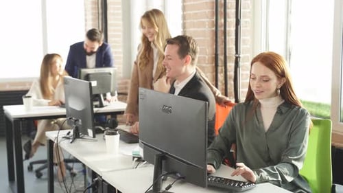 Attractive Redhead Female Office Worker Enjoys Working on Computer