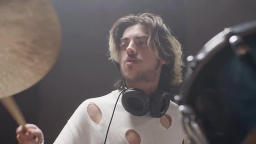 Young Male Drummer in Trendy Shirt Playing Drums