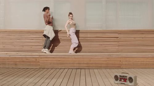 Woman and Man Dancing on Bench
