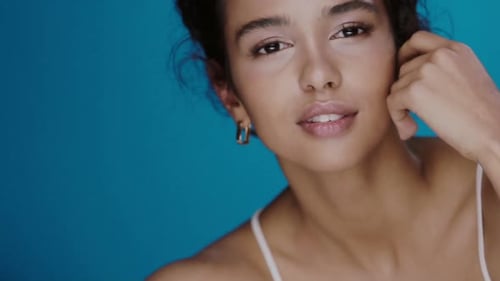 Elegant Woman Posing with Smooth Skin and Soft Smile