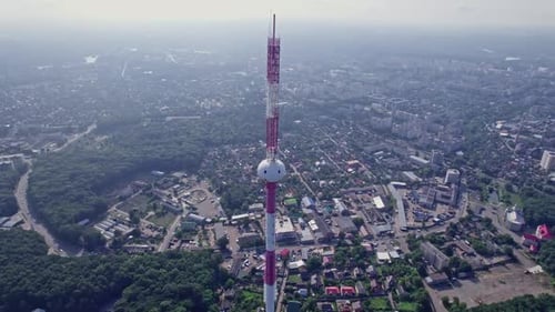 Flying Around the TV Tower Against the Backdrop of a Big City on