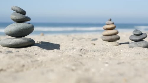 Rock Balancing on Ocean Beach Stones Stacking By Sea Water Waves