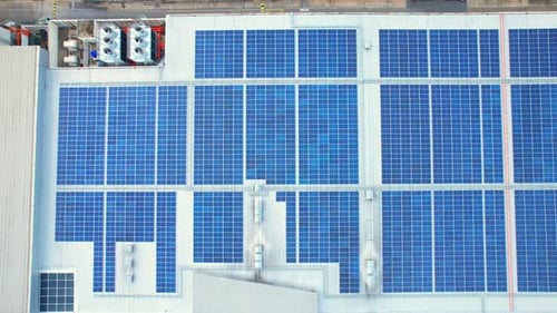 Drone flying over photovoltaic solar panels