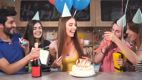 Young Woman Celebrates Birthday with Friends at Home