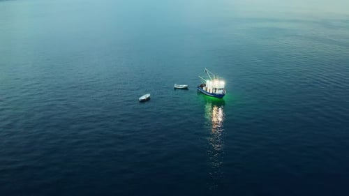 Evening Fishing From Vessel with Small Boats in Adriatic Sea