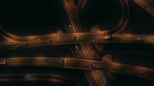 Top Down View of the Intersection of Flyovers and Highway with Bridges at Night
