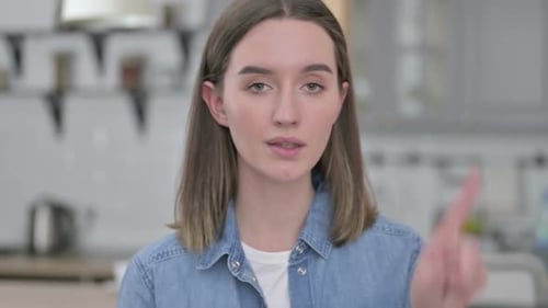Portrait of Ambitious Young Woman Saying No By Finger