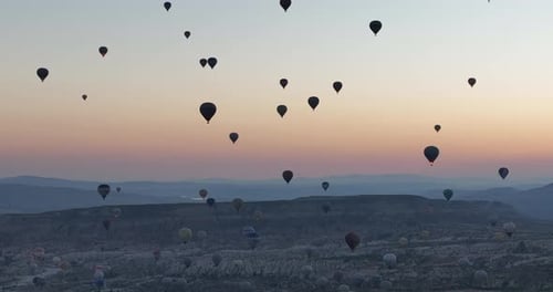 Aerial Cinematic Drone View of Colorful Hot Air Balloon Flying Over Cappadocia