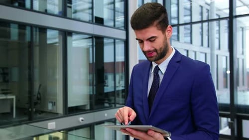 Man Using Tablet in Modern Office Building