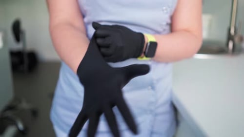 Young Woman Doctor Clothe Medical Gloves In Hospital Office. Healthcare and Medicine Concept.