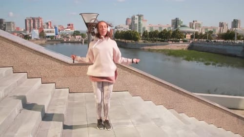 Woman Jumps Rope, City Background
