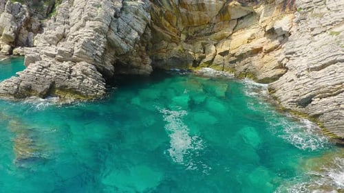 Aerial View of Sea Turquoise Waves and Fantastic Rocky Coast with Pine Trees Montenegro
