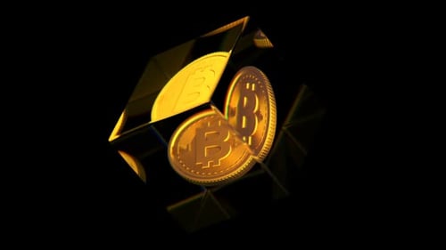 Crypto-monnaie numérique Bitcoin dans un cube de verre sur fond sombre
