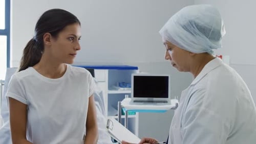 Doctor Explains Diagnosis to Young Adult Patient