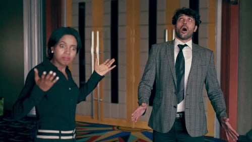 Frustrated Colleagues Arguing in Building Lobby