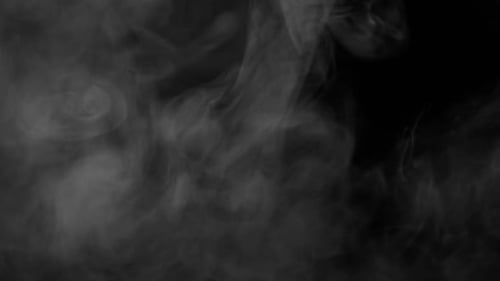 Gray Smoke Billowing Slowly on Black Background