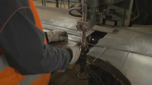 Metal Rods being Welded by Industrial Machine