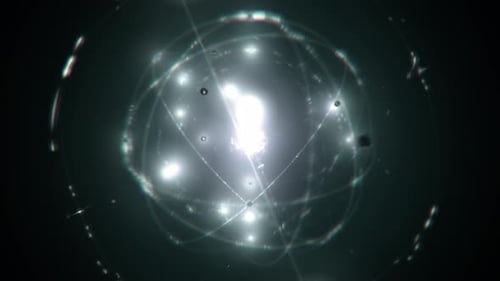 Conceptual Model of Atomic Nucleus and Electrons on Green and Black Background