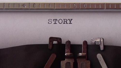 Typing word STORY on retro typewriter. Close up.