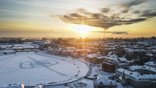 City panorama. Frosty winter evening. Cinematic sunset with bright gradient sky