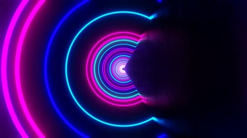 Looped Abstract Background of Flight Forward and Rotation in Neon Circles Tunnel