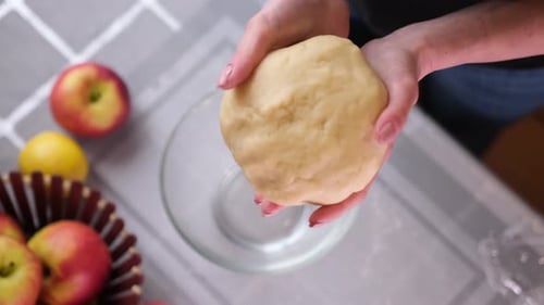 Woman Kneads Dough for Apple Pie Pastry