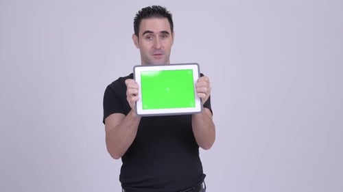 Man Holding Tablet with Green Screen Talking