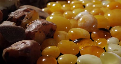 Display of Polished Amber Stones in Abstract Still Life