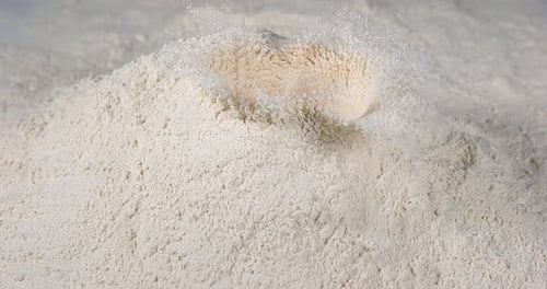 Eggs Falling on Flour, Slow Motion 4K