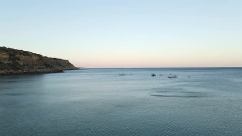 Aerial footage of several fishing boats docked in the water