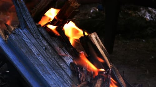 Fire Burning on Weathered Wood Planks