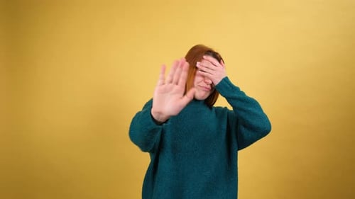 Young Red Hair Woman Posing Isolated on Yellow Color Background Studio