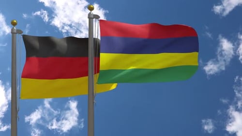 Germany and Mauritius Flags Waving Under Blue Sky