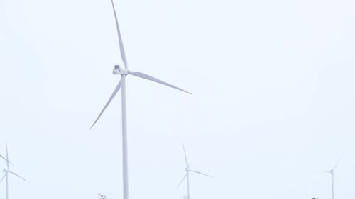 Wind Turbines Turning in Rural Setting
