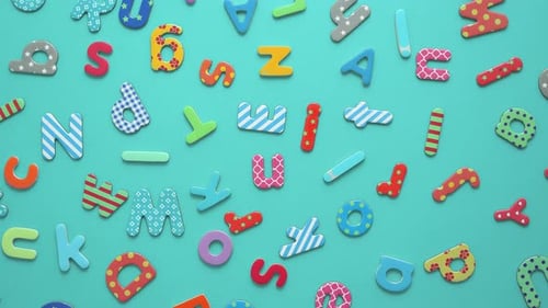 Animated Patterned Letters on Light Blue Background