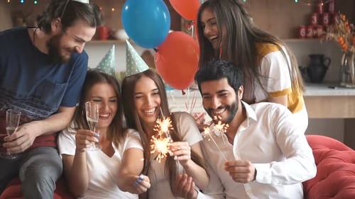 Happy Friends Celebrating Birthday with Sparklers
