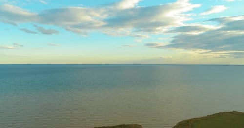 Aerial Hyperlapse of Sunset and Clouds Above Sea Coast