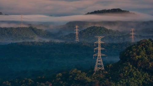 Aerial view high voltage power transmission towers.