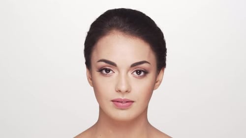 Studio portrait of young and beautiful brunette woman over