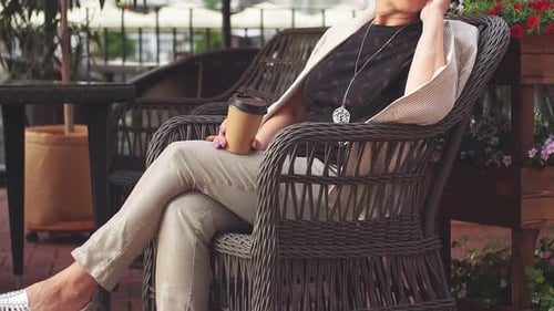 Portrait of Modern Stylish Lady Sitting in Street Cafe