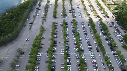Aerial View of a Large Parking Lot with Cars